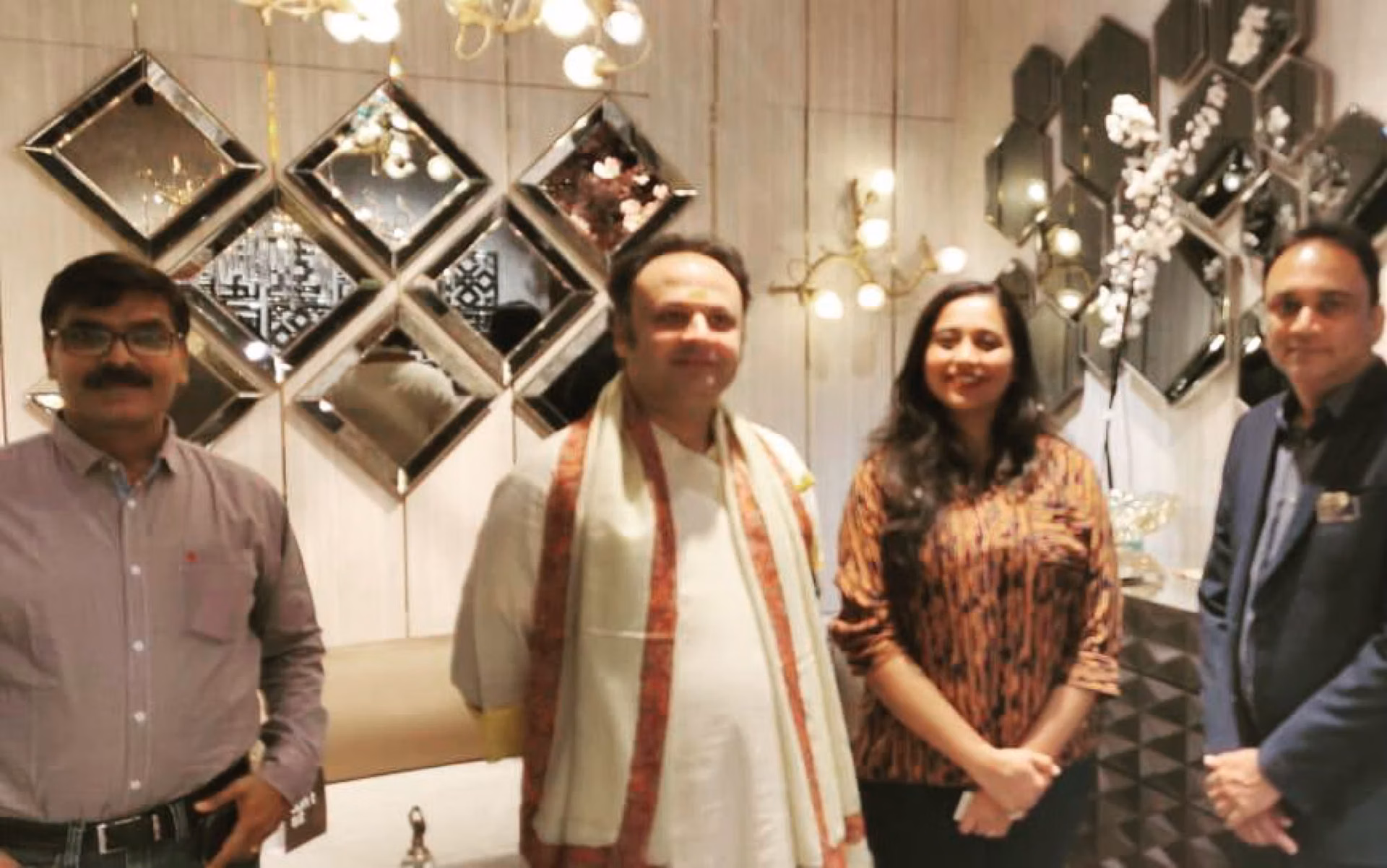 Goswami Shri Dwarkeshlalji Maharajshri with the Designatore team in the showroom.
