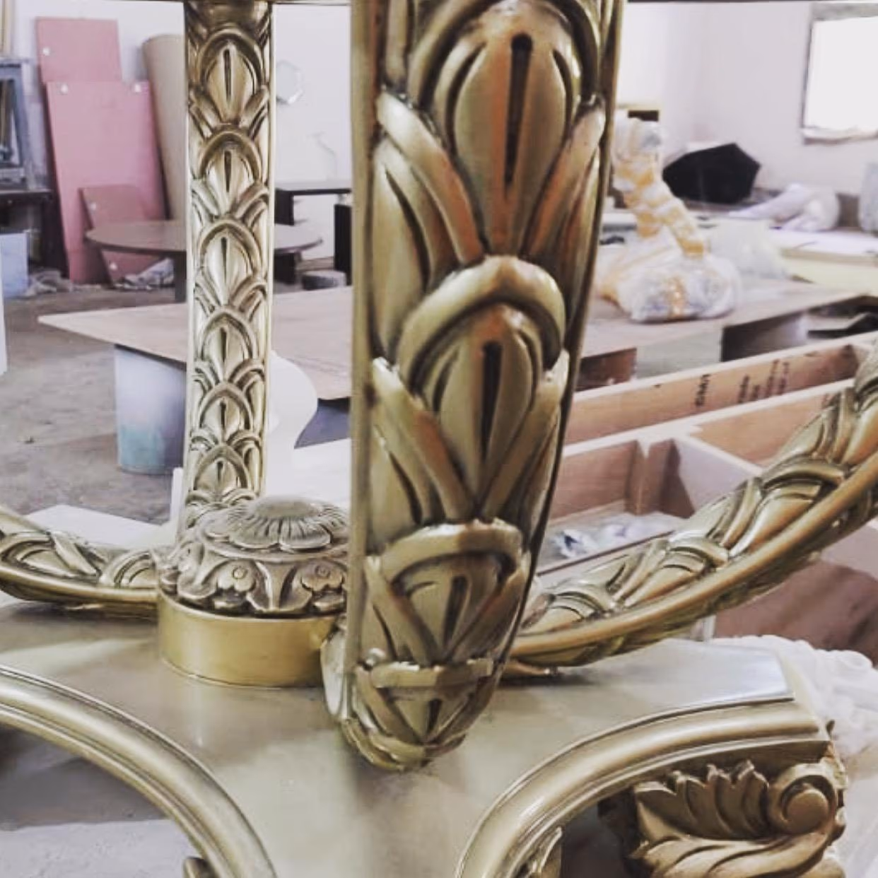 A hand-carved and gilded table pedestal, the kind of luxury furniture warranty and after-sales care this guide covers.
