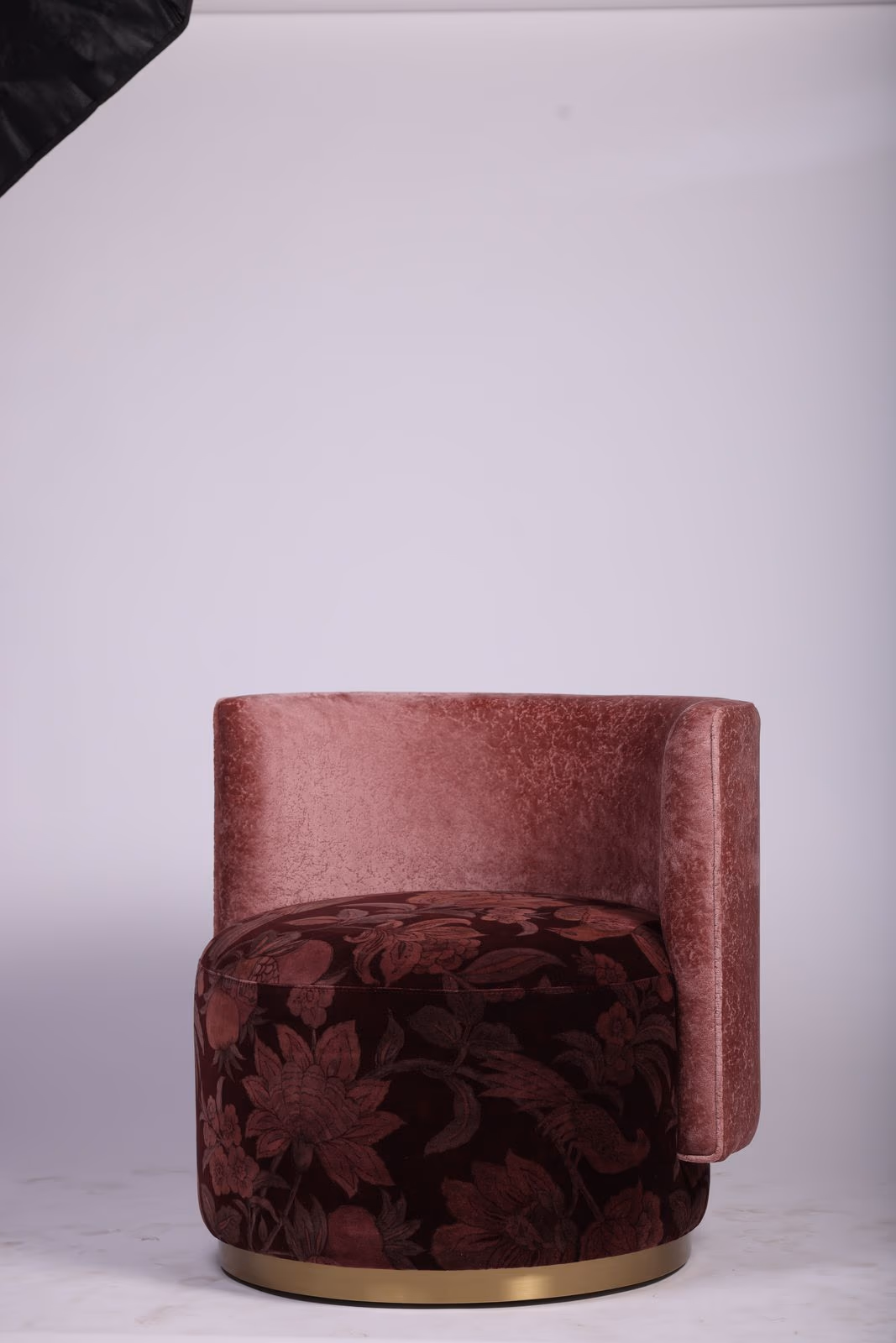 Curved rose velvet vanity chair with a maroon floral-print seat cushion and gold trim base.