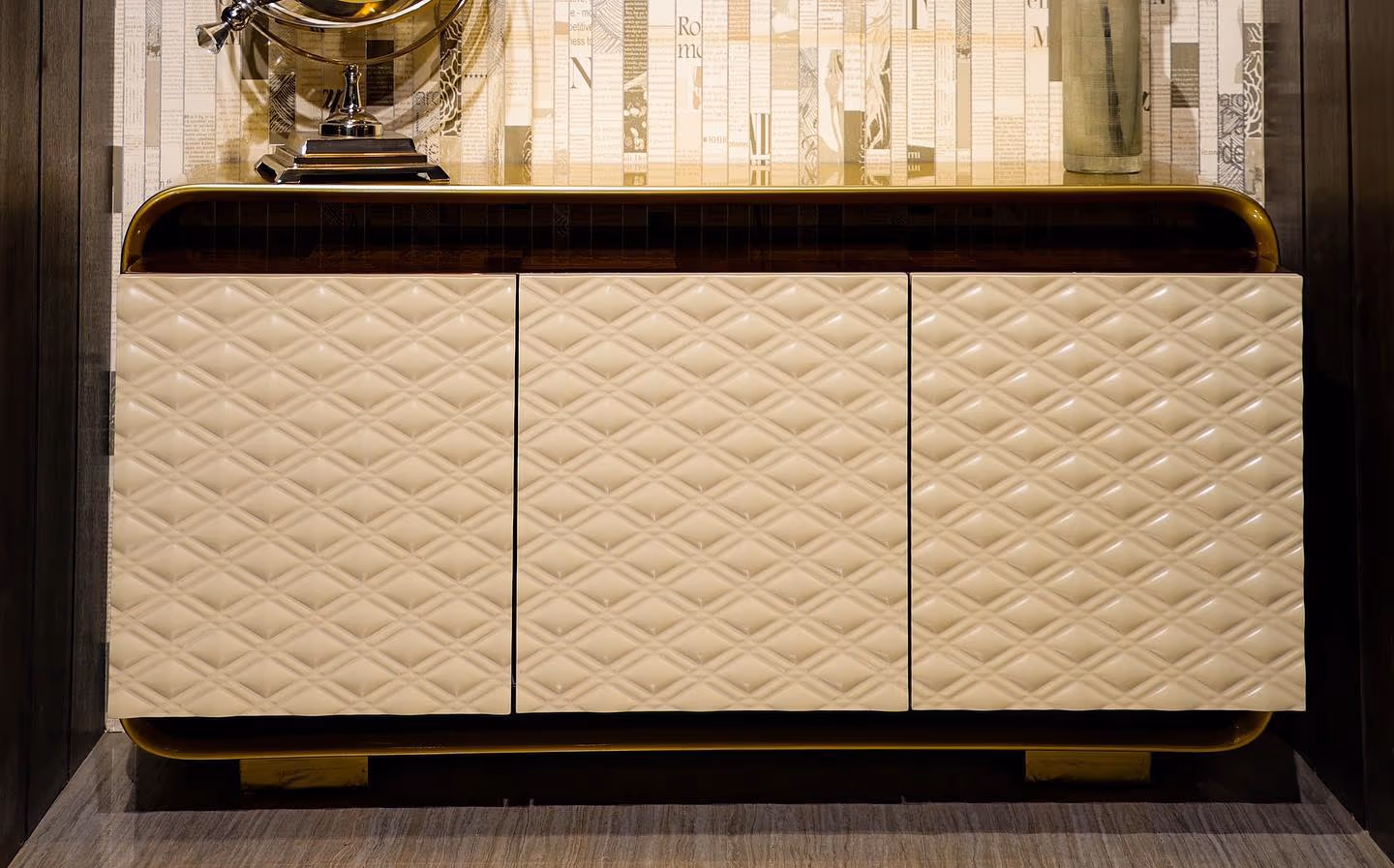A close view of fine wood veneer and grain on a luxury console.