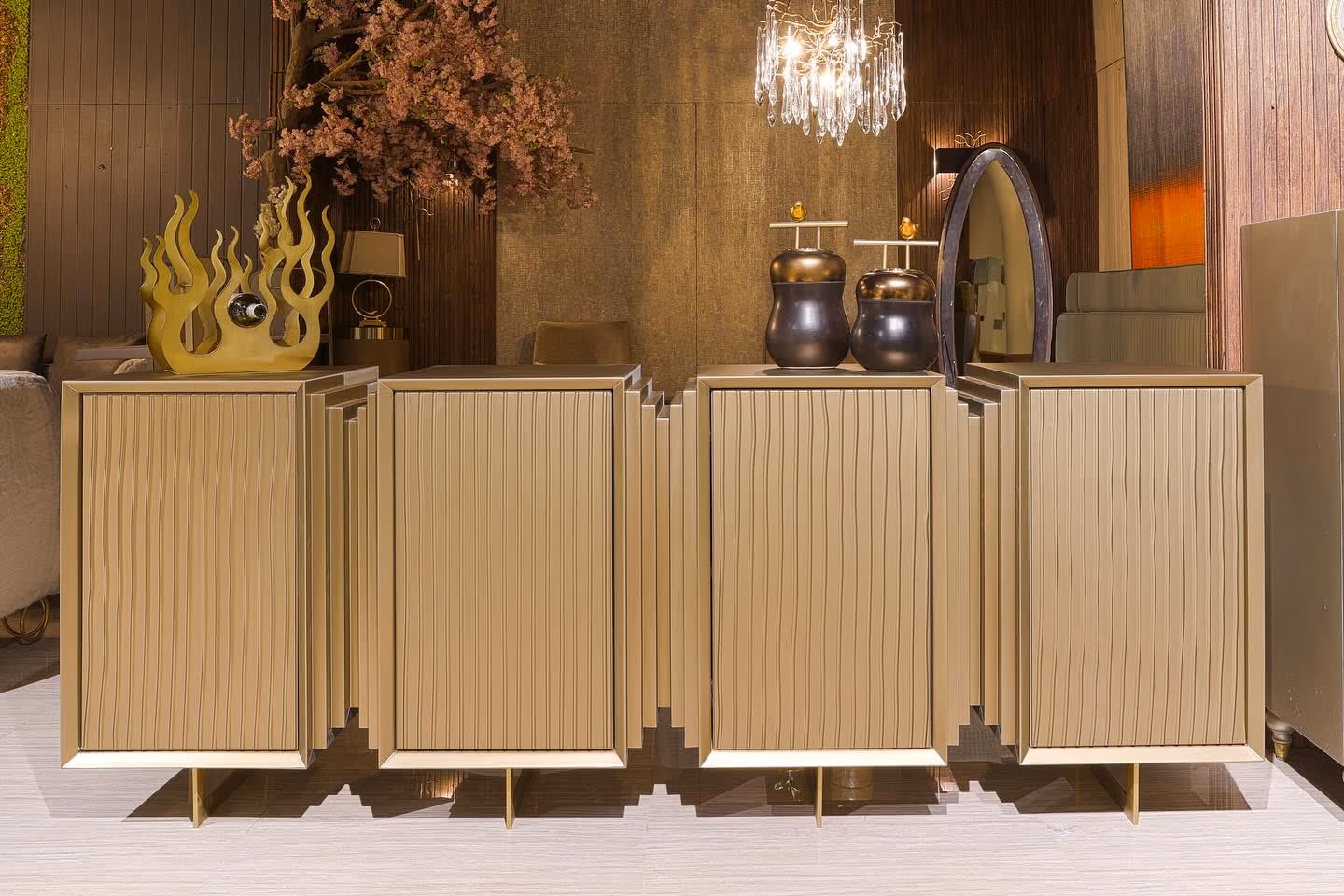 A fluted console being fitted to a wall, showing fine joinery and finish.