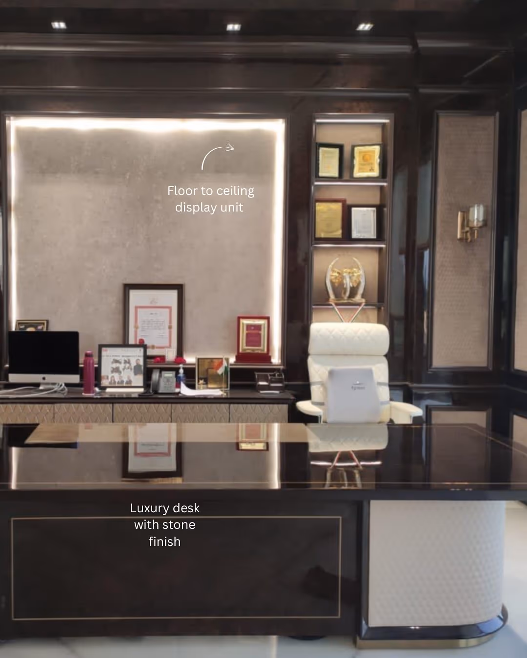 A fitted luxury display and storage unit built to the exact wall of a modern living room.