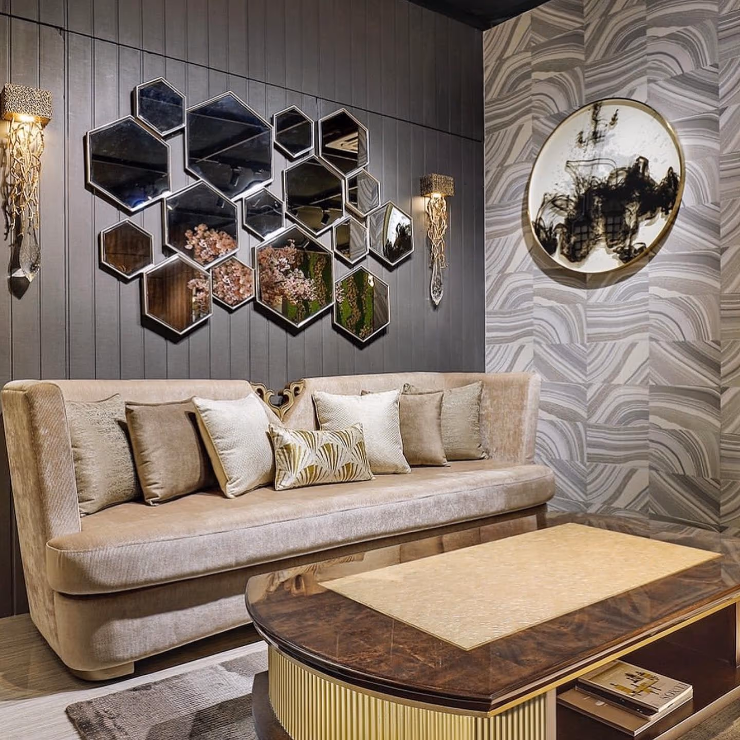 A tufted luxury sofa in a warm, glamorous living room setting.