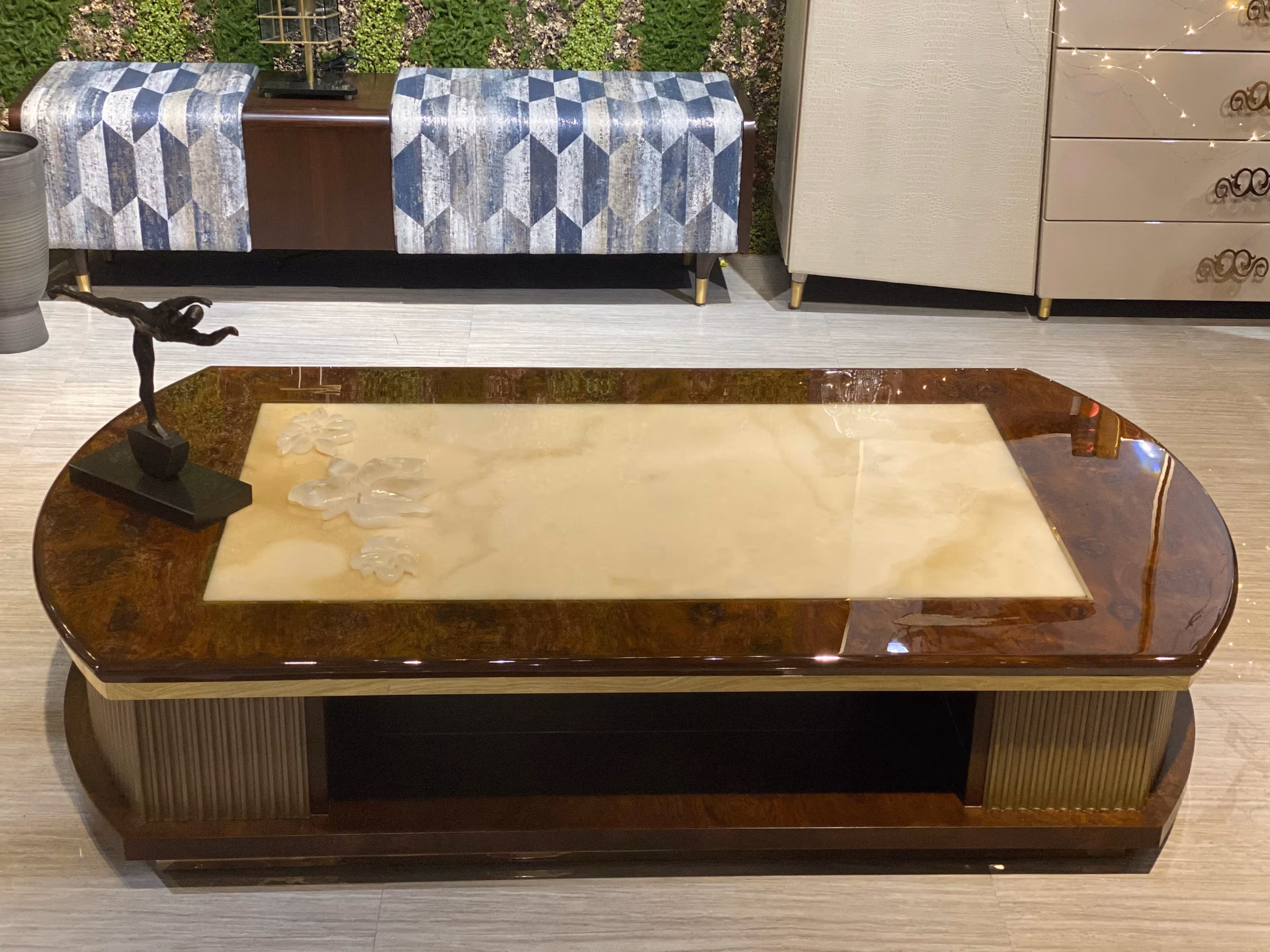 A bespoke burl wood and backlit onyx coffee table made in India for a luxury living room.