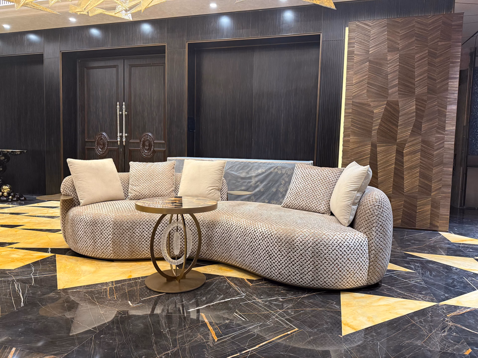 A Designatore living room set on marble floor — velvet lounge sofas, centre table and consoles, made to fit the whole room.