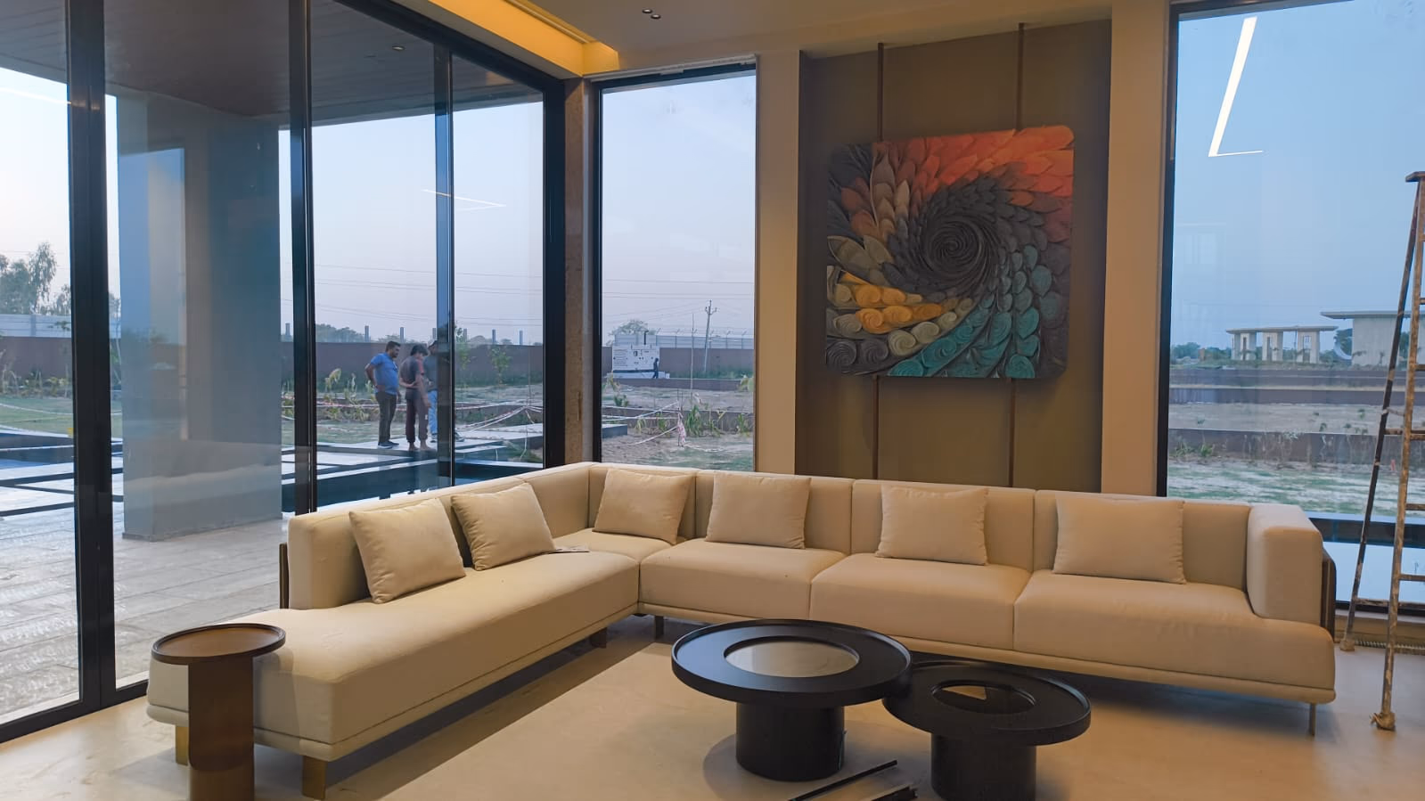 A finished living room where every piece was made to the designer's drawing and the room's exact wall and window sizes.