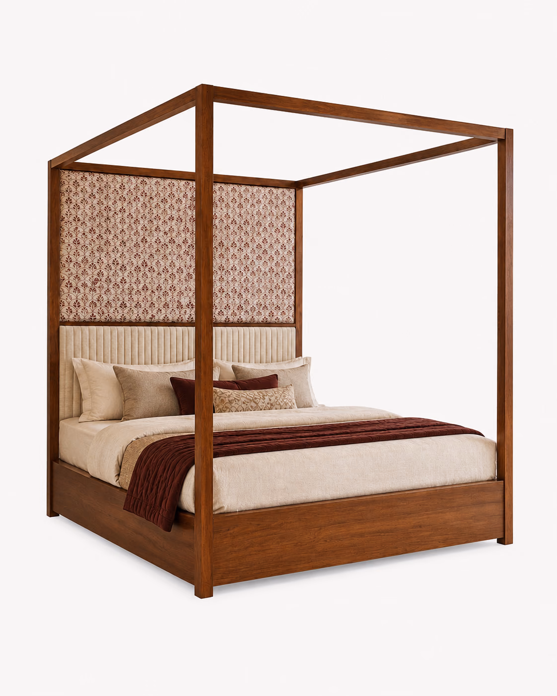 Designatore four poster bed in warm solid wood with a clean square canopy frame, a hand block printed fabric panel in maroon on cream above a channel-tufted ivory upholstered headboard, shown alone on a white ground.