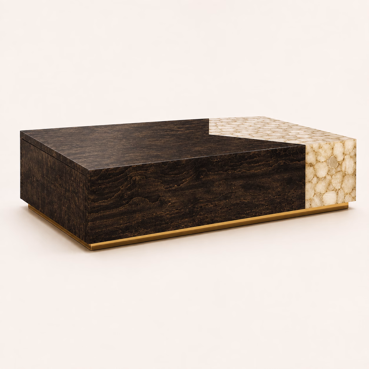 Designatore rectangular centre table shown alone on a bone ground, built as a low block in dark high-gloss veneer with an organic figure, with a corner section inlaid in pale hand-set precious stone and a slim gold-tone base line.