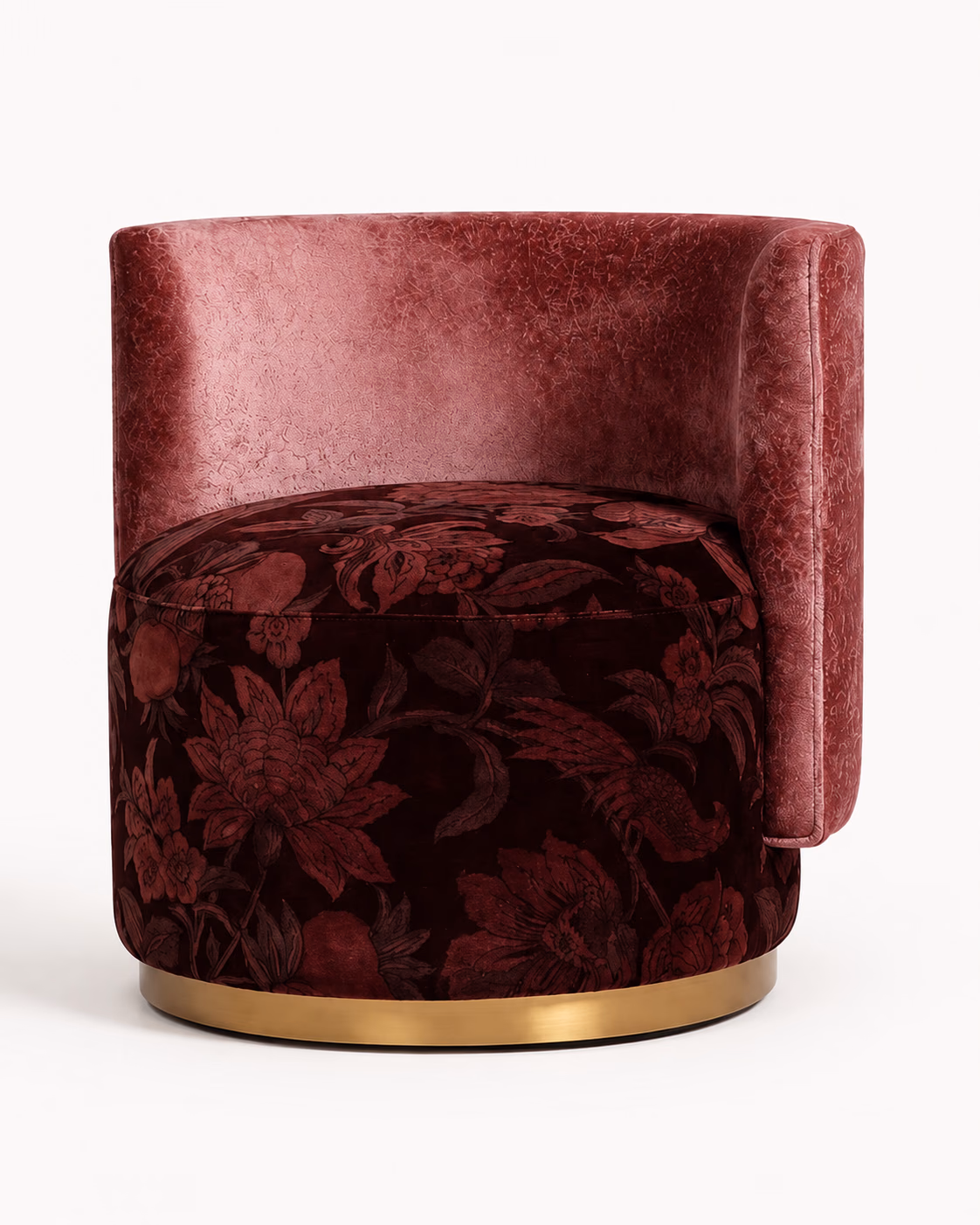 Designatore dressing room chair shown alone on a pale ground, with a low curved back and arms in rose blush textured velvet above a round drum seat upholstered in a dark burgundy floral jacquard, standing on a brushed brass base ring.
