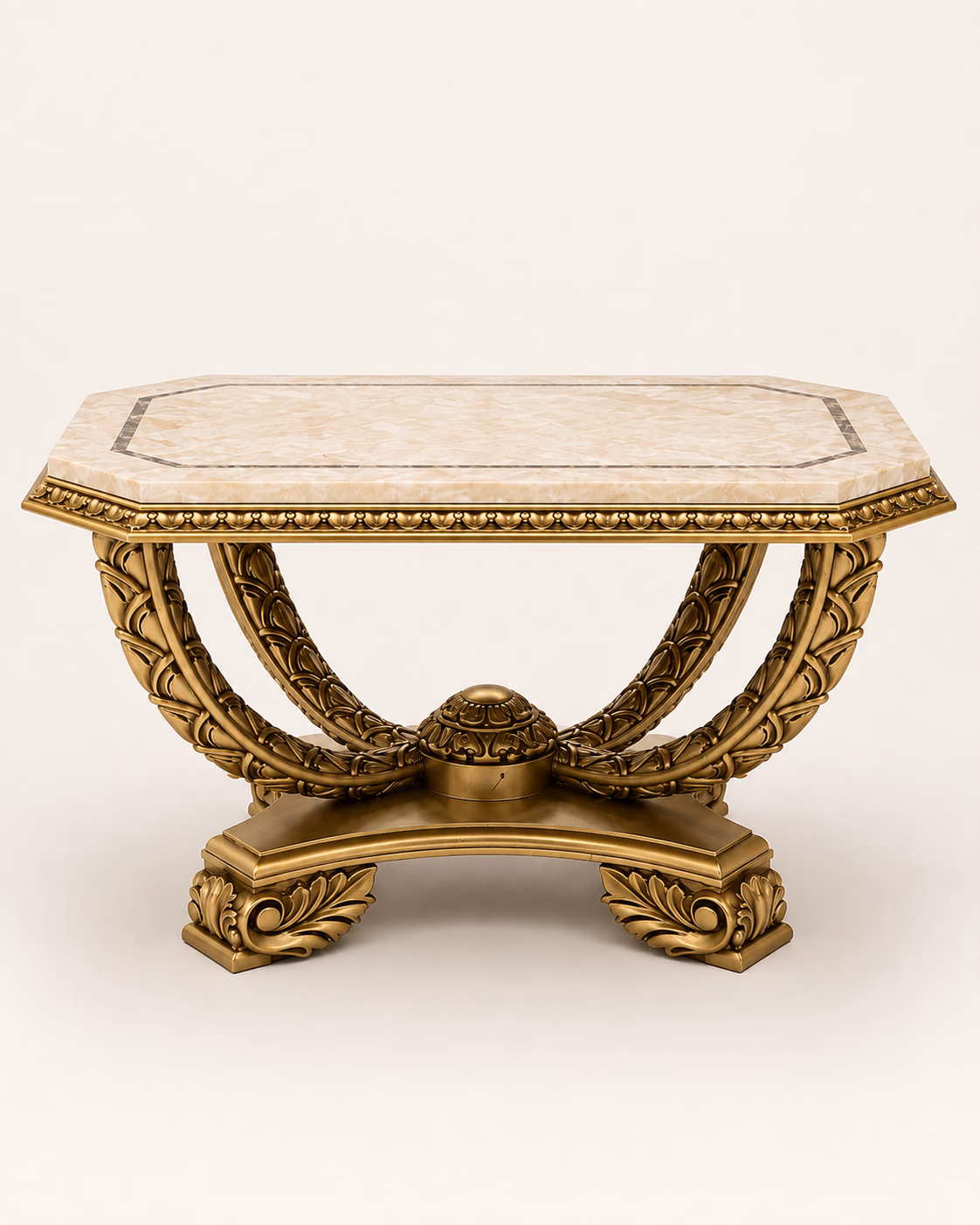 Designatore octagonal foyer table shown alone on a bone ground, with a translucent cream onyx marble top framed by a beaded antique gold moulding, over hand-carved acanthus leaf arches meeting at a carved central boss on a scrolled four-footed base.