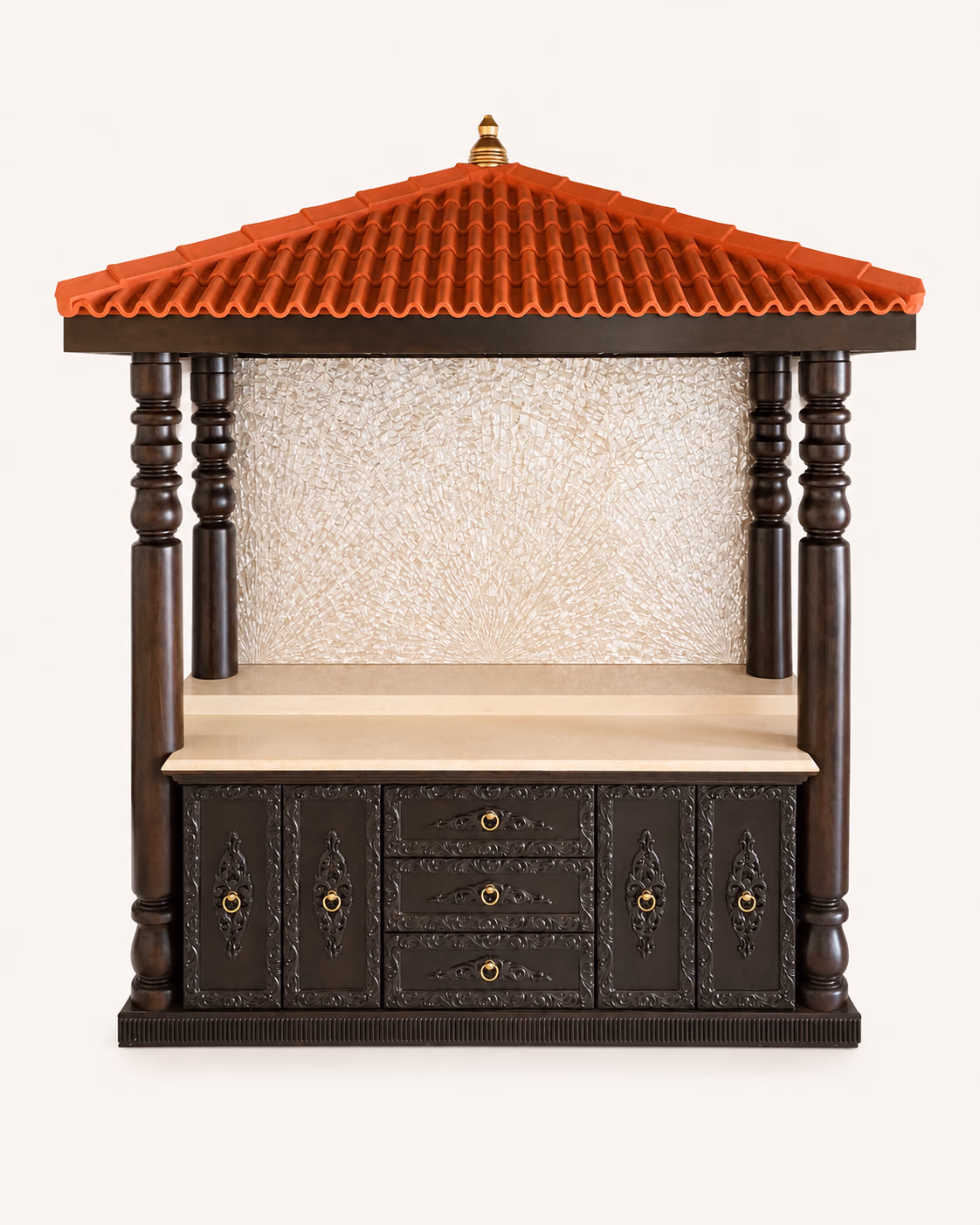 Designatore South Indian hut style pooja mandir shown alone, with a terracotta Mangalore tile roof topped by a brass kalash finial, four hand-turned dark wood temple pillars, a radiant metallic-texture back panel, a cream natural stone platform and a carved base cabinet with brass ring handles.
