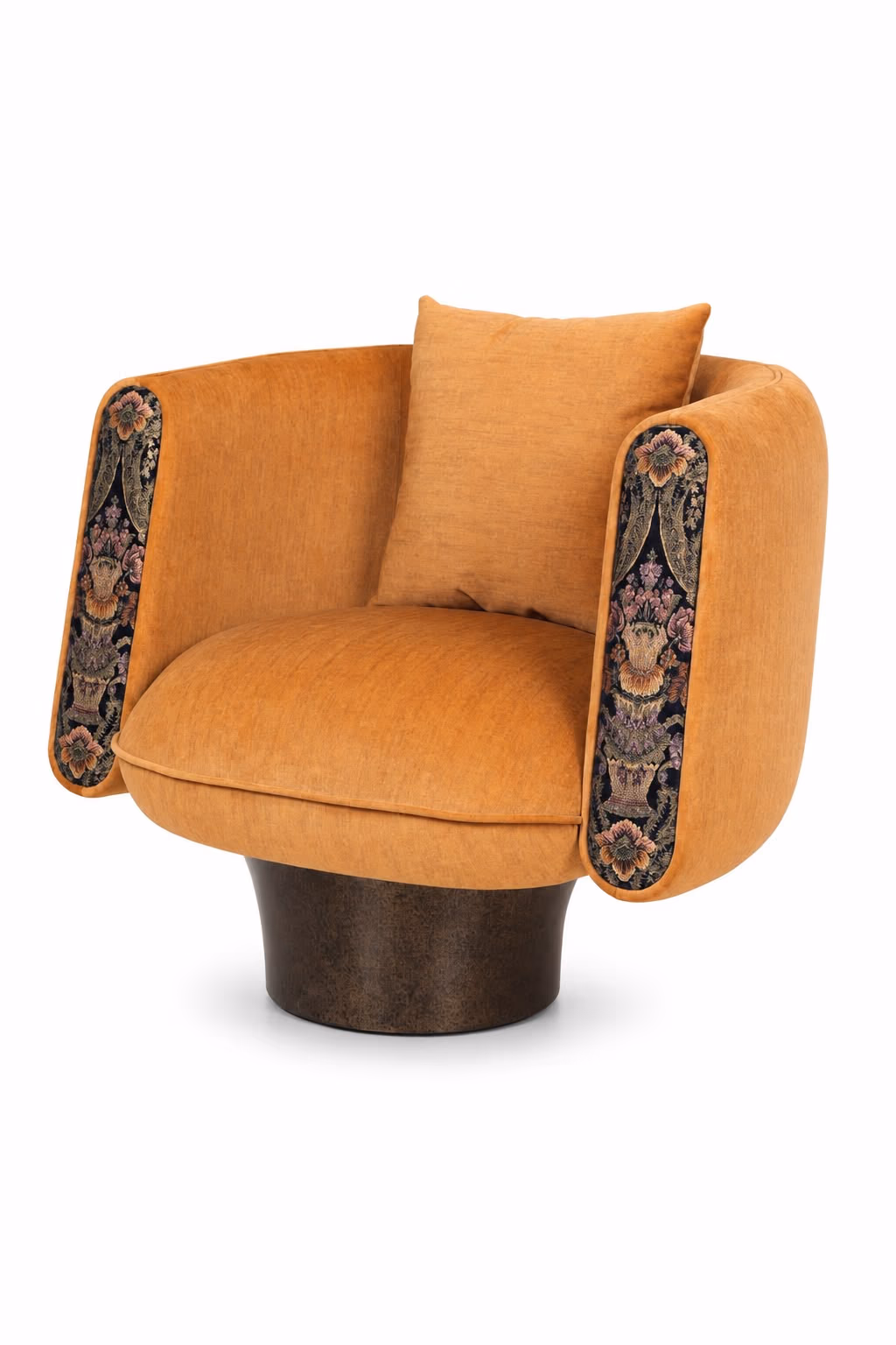 Designatore single seater swivel chair shown from the side, upholstered in warm mustard velvet with a curved barrel back, a loose bolster cushion, embroidered floral accent panels down the inner arms and a drum base in an antique brass finish.